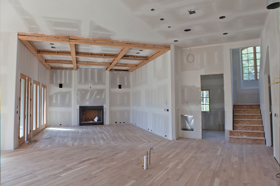 Post-construction cleaning crew working on finished interior space