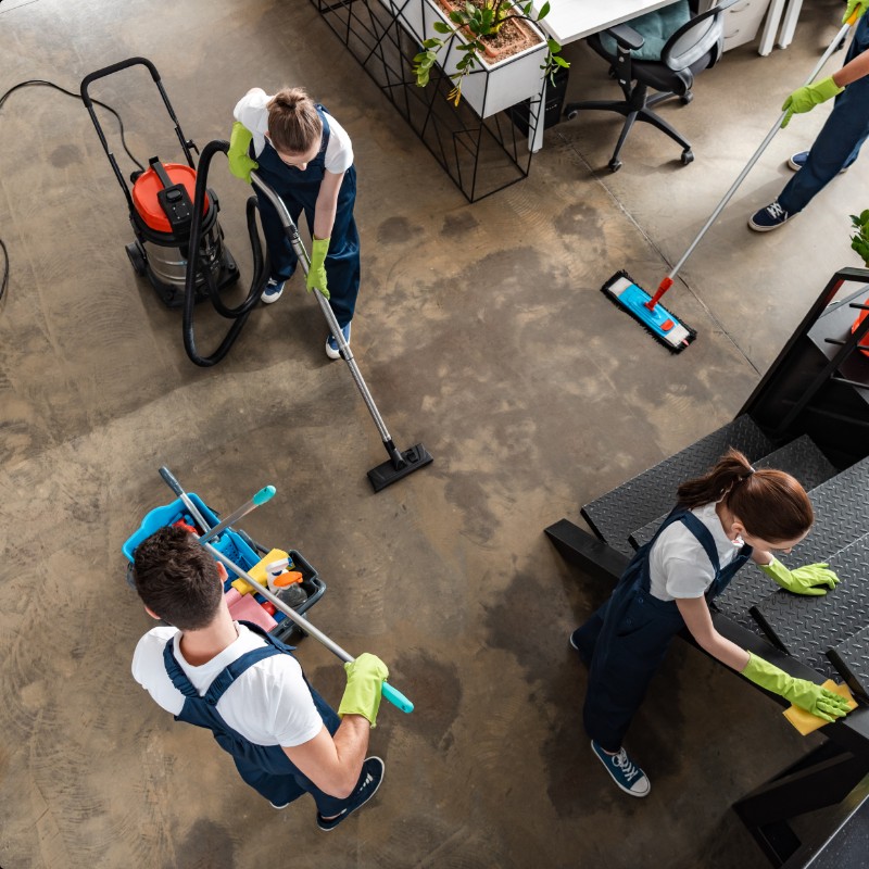 Post-construction cleaning crew working on finished interior space