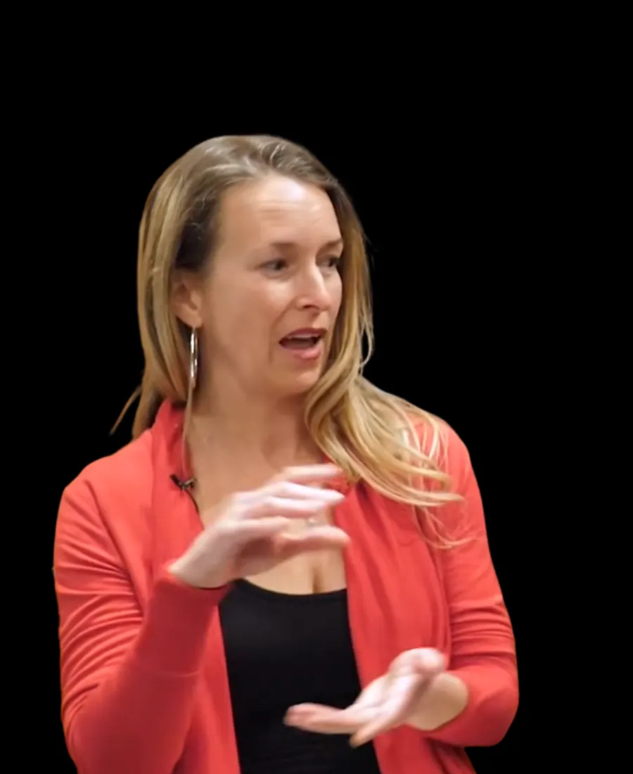 Candid, energetic portrait of Dina Colada mid-conversation gesturing in an editorial studio setting