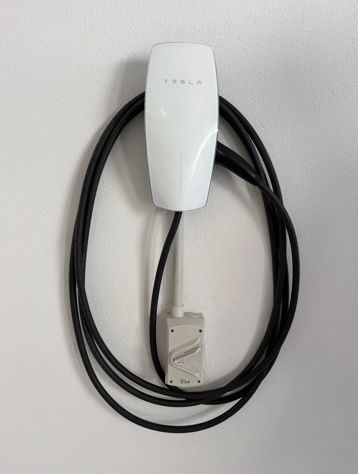 Completed wall-mounted EV charging station installation in Perth garage
