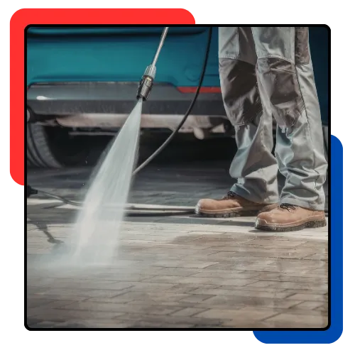 Pressure Washer in Davie, FL cleaning a stained driveway at a home