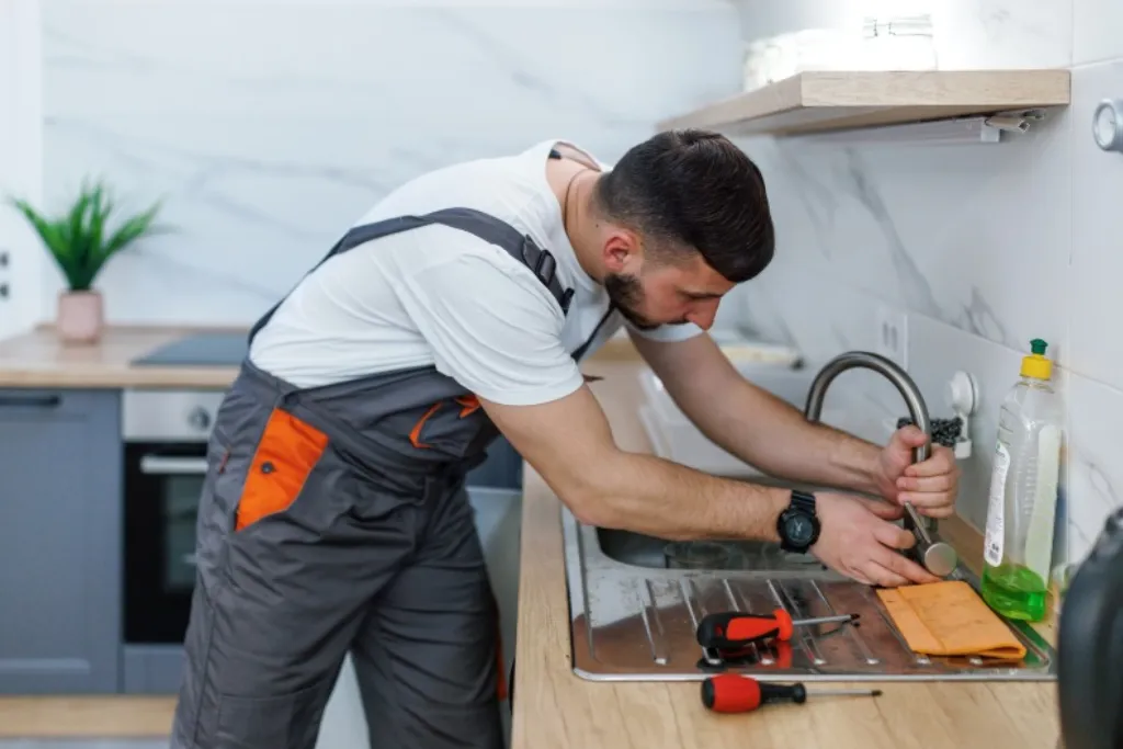 Gino Construction fitting a new sink during a full kitchen renovation in Plumstead.