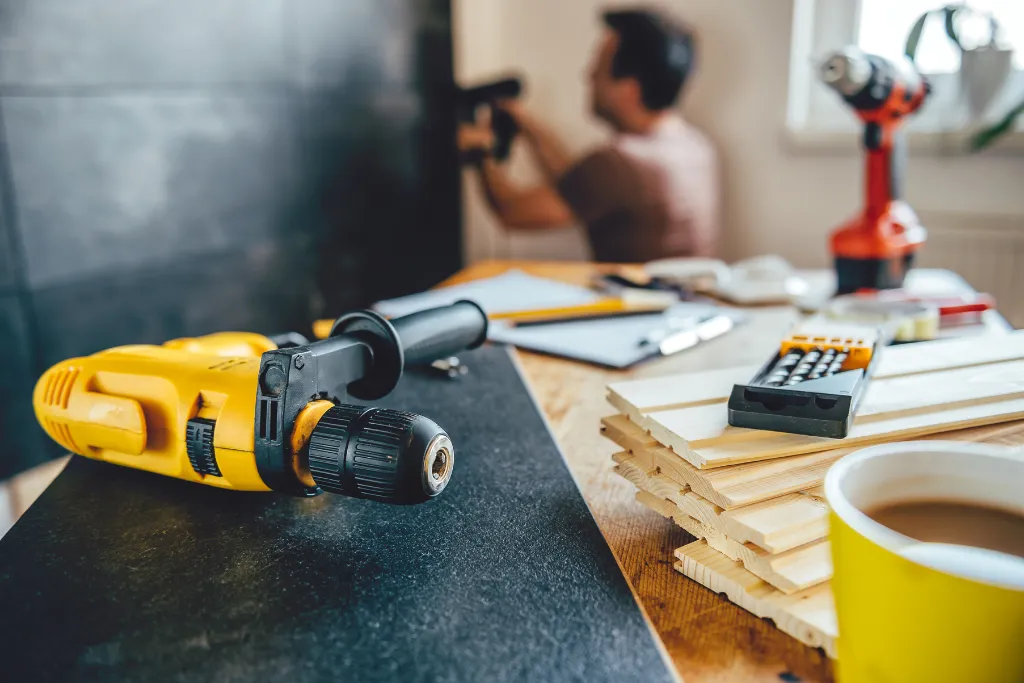 Drill and tools for a home improvement project by Gino Construction in the Greenwich borough.