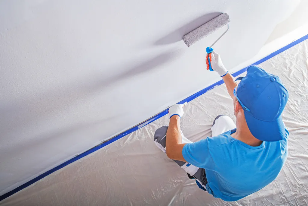 Professional painter from Gino Construction providing interior decorating services in Southeast London.