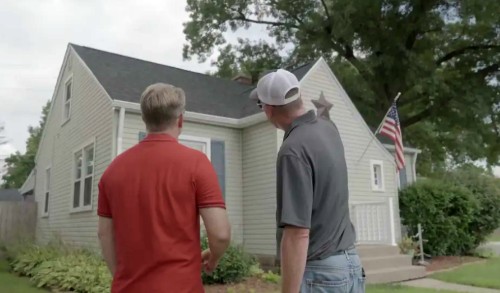 Twin Bridge Roofing completing a final exterior walkthrough with homeowners after project completion