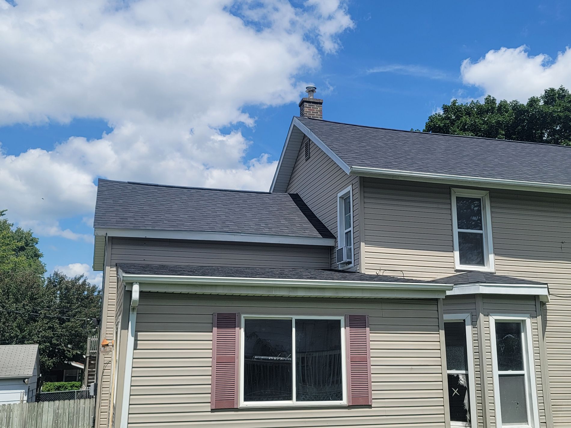 Roof installation on two-story home by Twin Bridge Roofing & Construction in Illinois