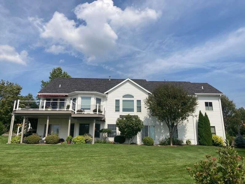Finished asphalt shingle roof on residential home by Twin Bridge Roofing & Construction