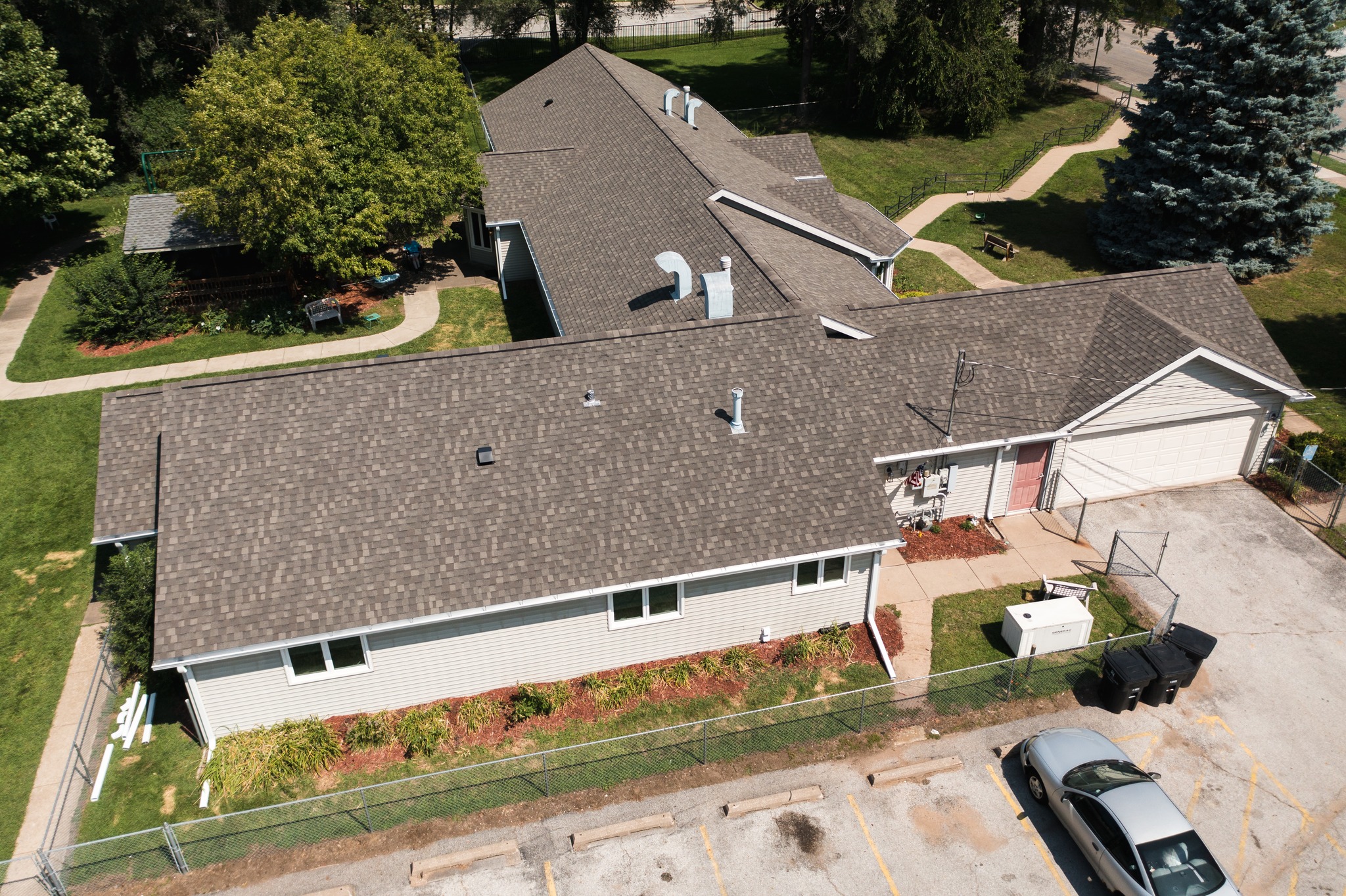 Finished asphalt shingle roof installation by Twin Bridge Roofing & Construction in Illinois