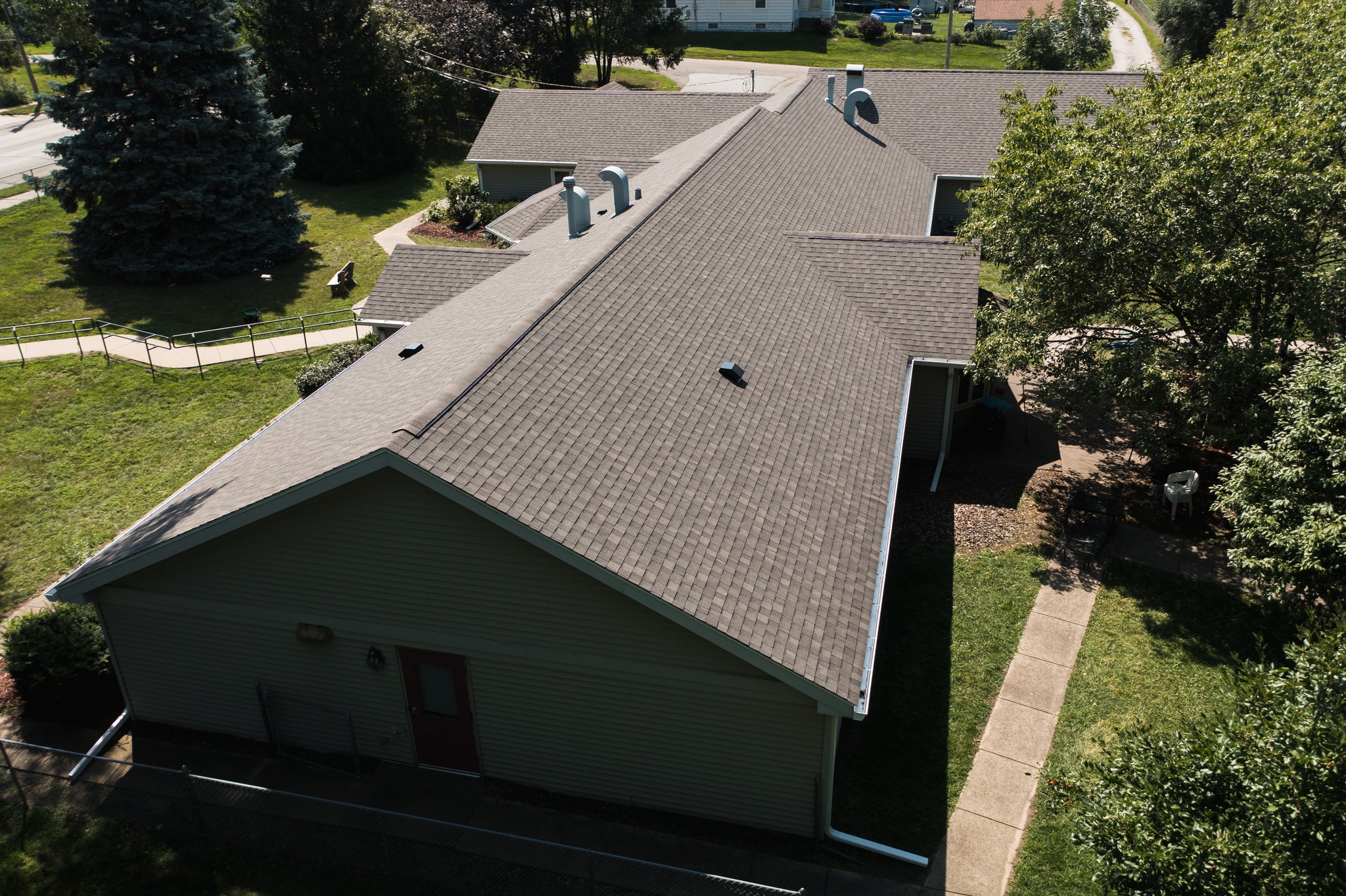 Drone photo of finished residential roof installed by Twin Bridge Roofing & Construction