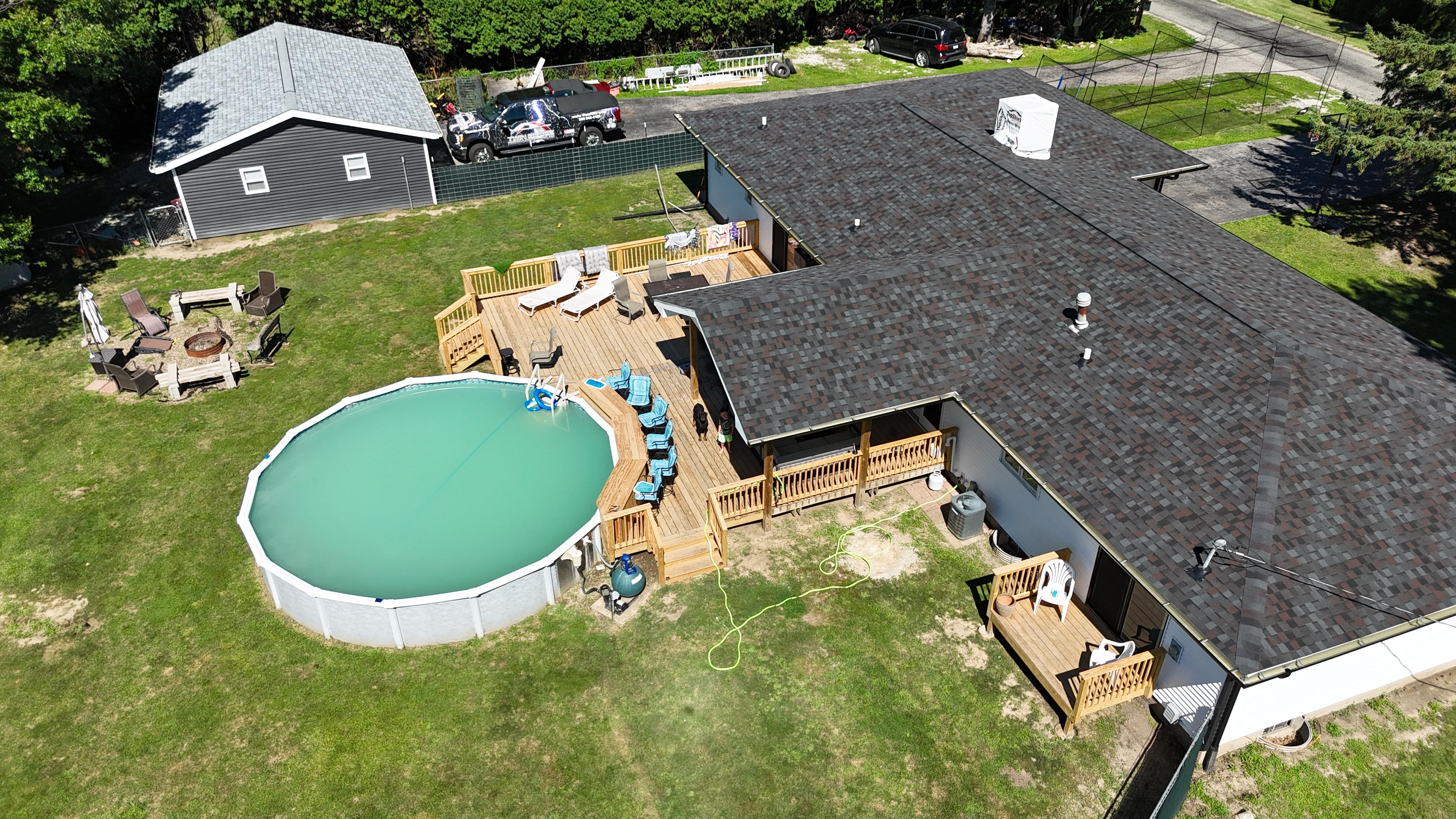 Aerial view of residential roofing project completed by Twin Bridge Roofing & Construction
