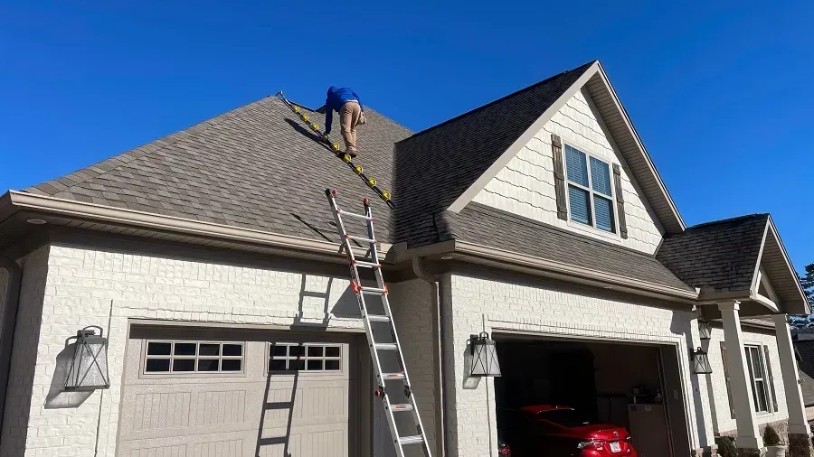 Roof inspection on a home in Moline before winter