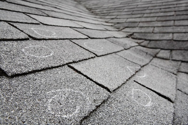 Roof with hail damage after a Quad Cities storm