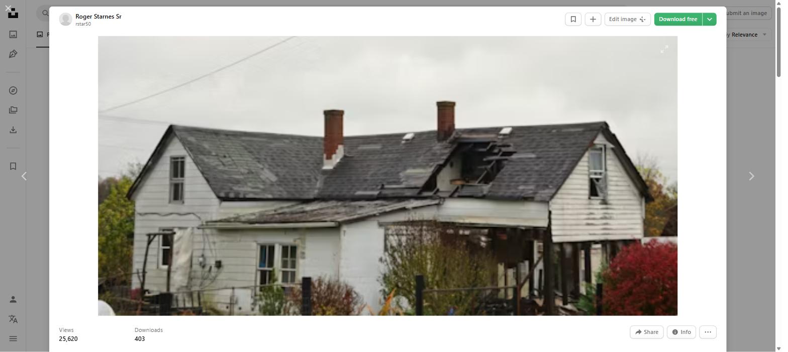 Home with storm damage roof in the Quad Cities