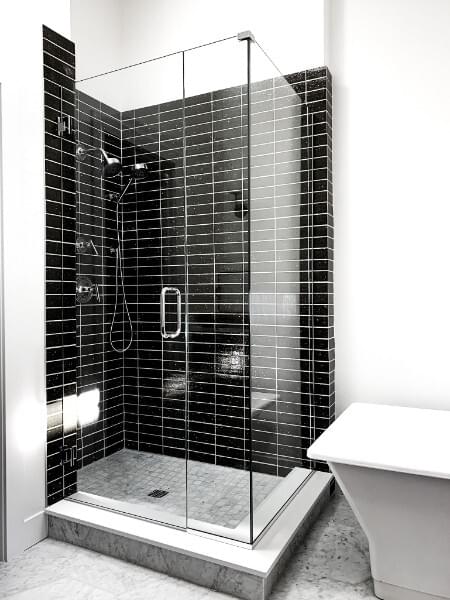 Frameless 90 degree glass shower enclosure