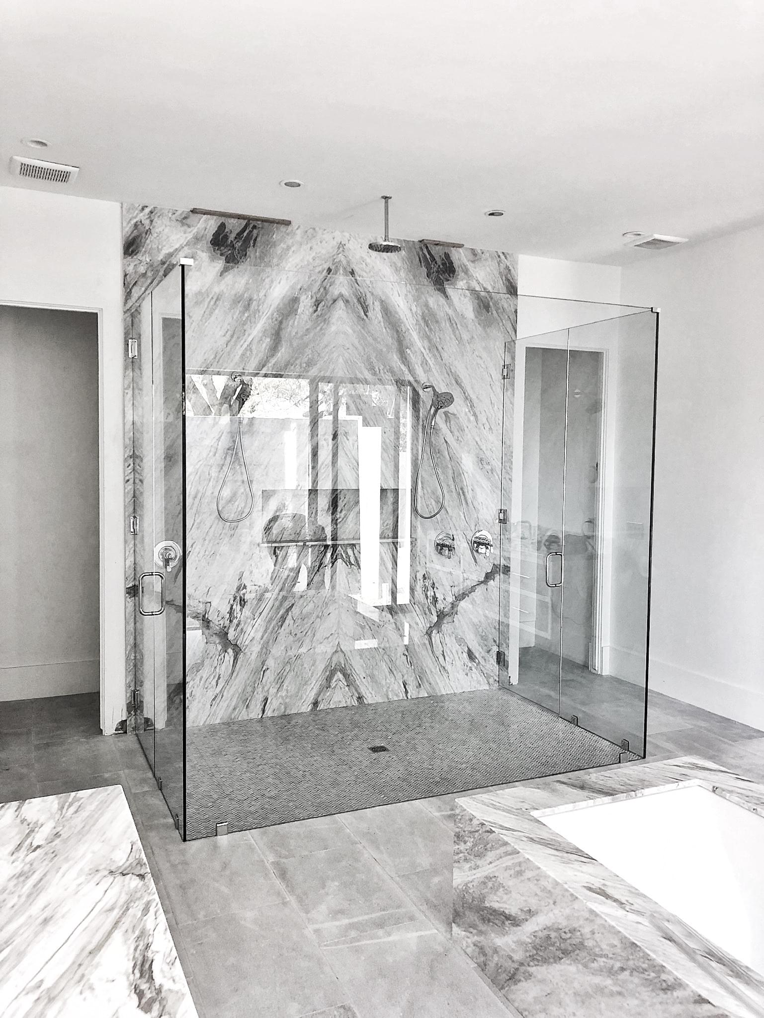 Curbless frameless 3 sided shower with 2 shower doors