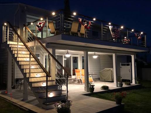 a room with two windows and a toilet