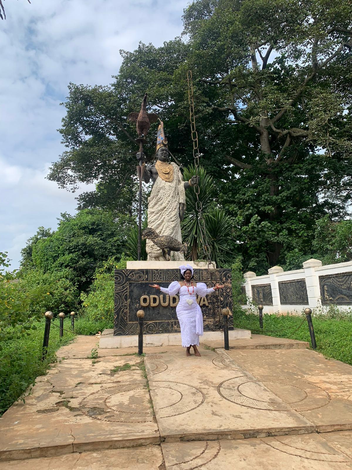 two elephants walking on grass covered ground