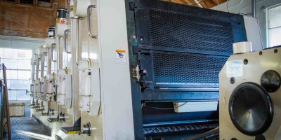 High-resolution editorial photo of eco-friendly pharmaceutical printing process using soy inks and PCW paper