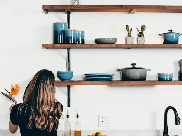 Renovated bathroom in Rockville MD with modern fixtures, walk-in shower, freestanding tub, marble countertops, and natural light.