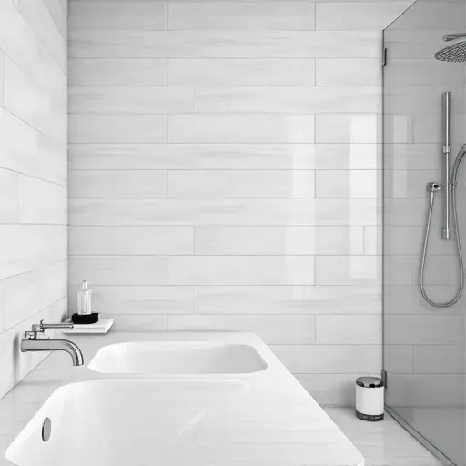 Freshly completed modern ceramic bathroom wall tiles in soft gray with polished grout, in a well-lit, elegant bathroom setting