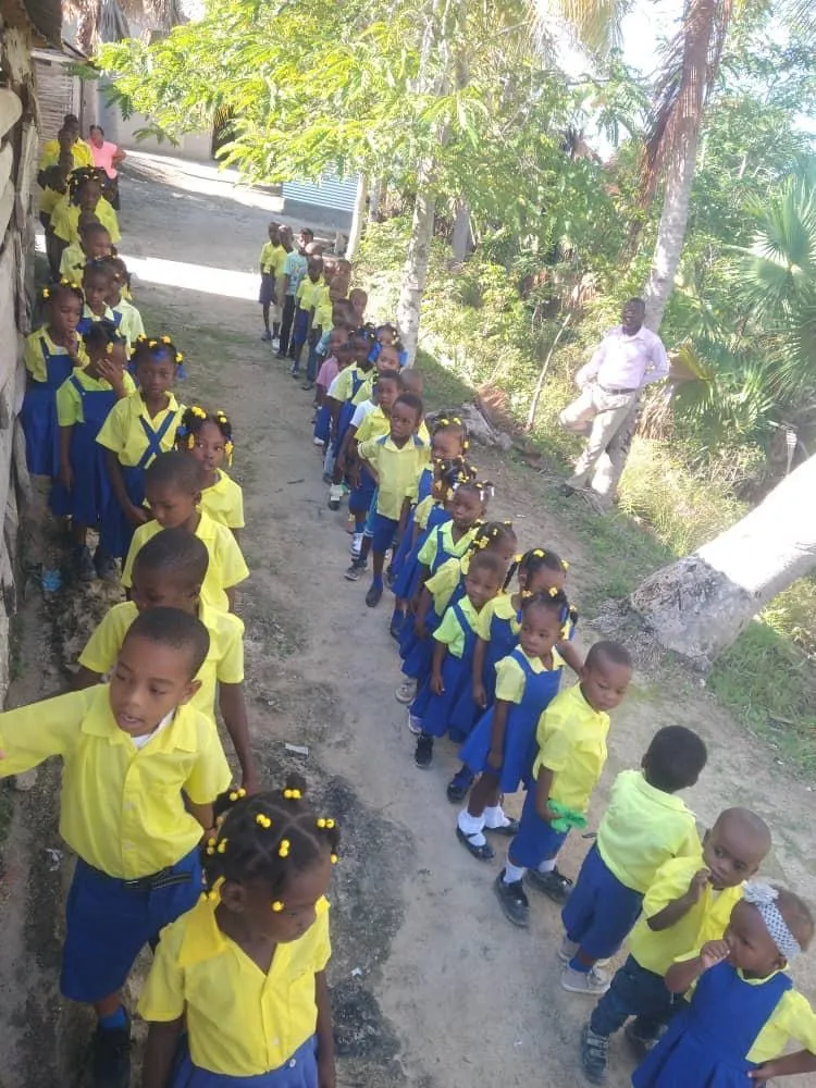 Bishop Paulin Maurice Michel and the foundation's humanitarian team delivering aid