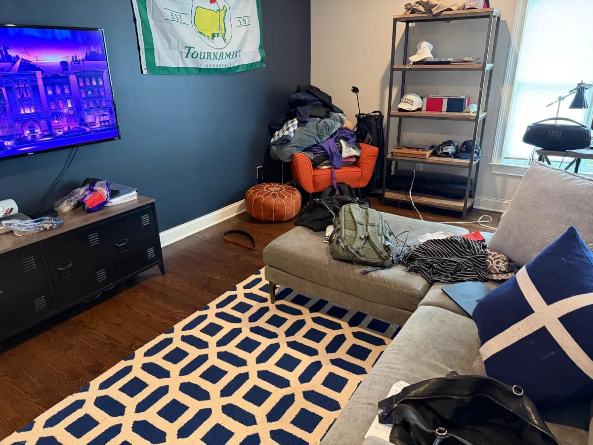 Professional cleaner organizing a closet