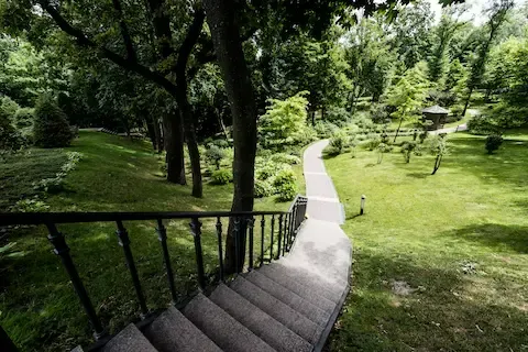 Concrete walkway and steps through landscaped yard by Camas Concrete.