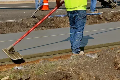 Fresh concrete sidewalk installation and grading by Camas Concrete.