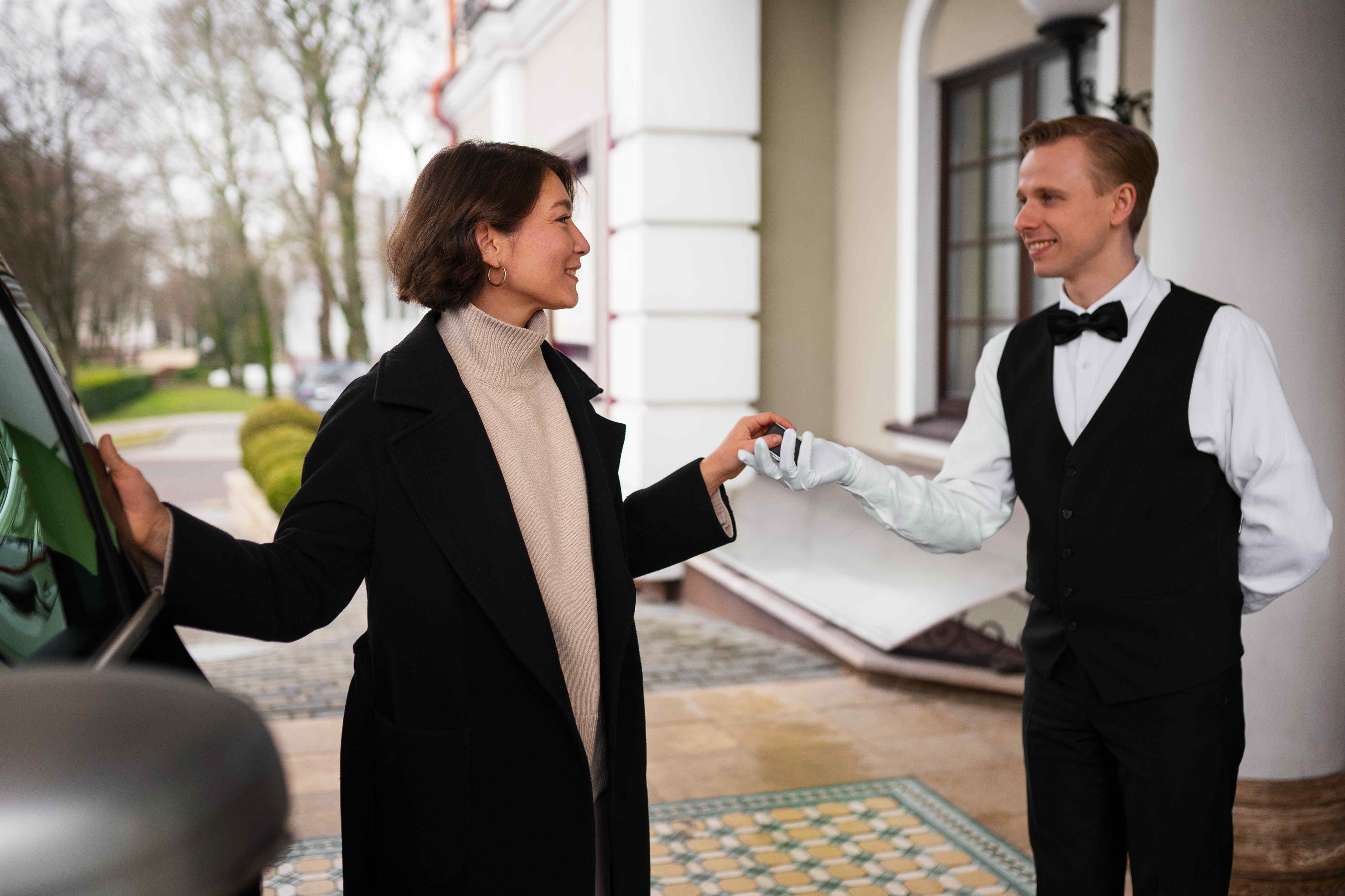 Hotel doorman greeting guests at the entrance in New York City