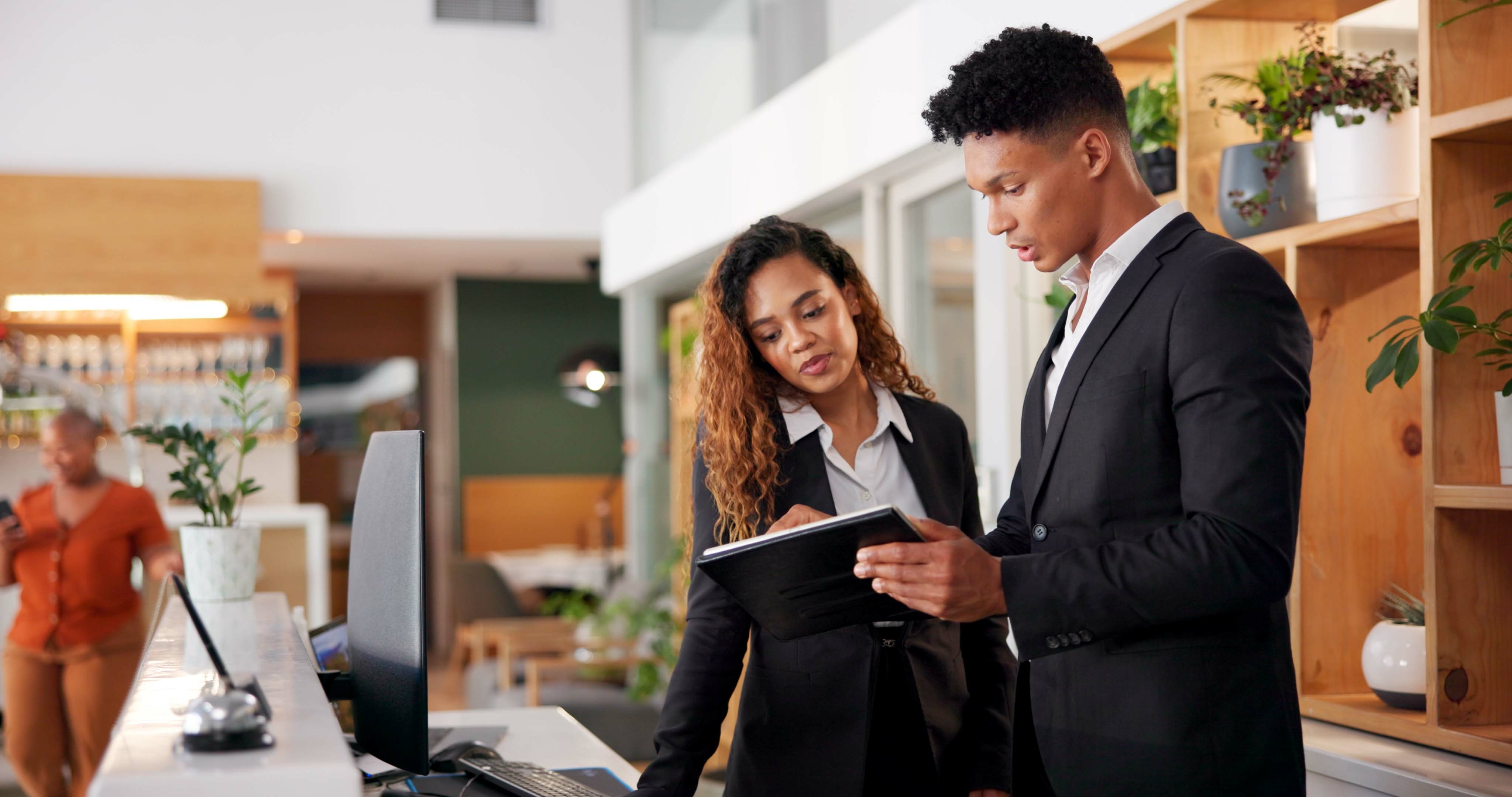 Hotel worker reviewing a pay stub and workplace rights information