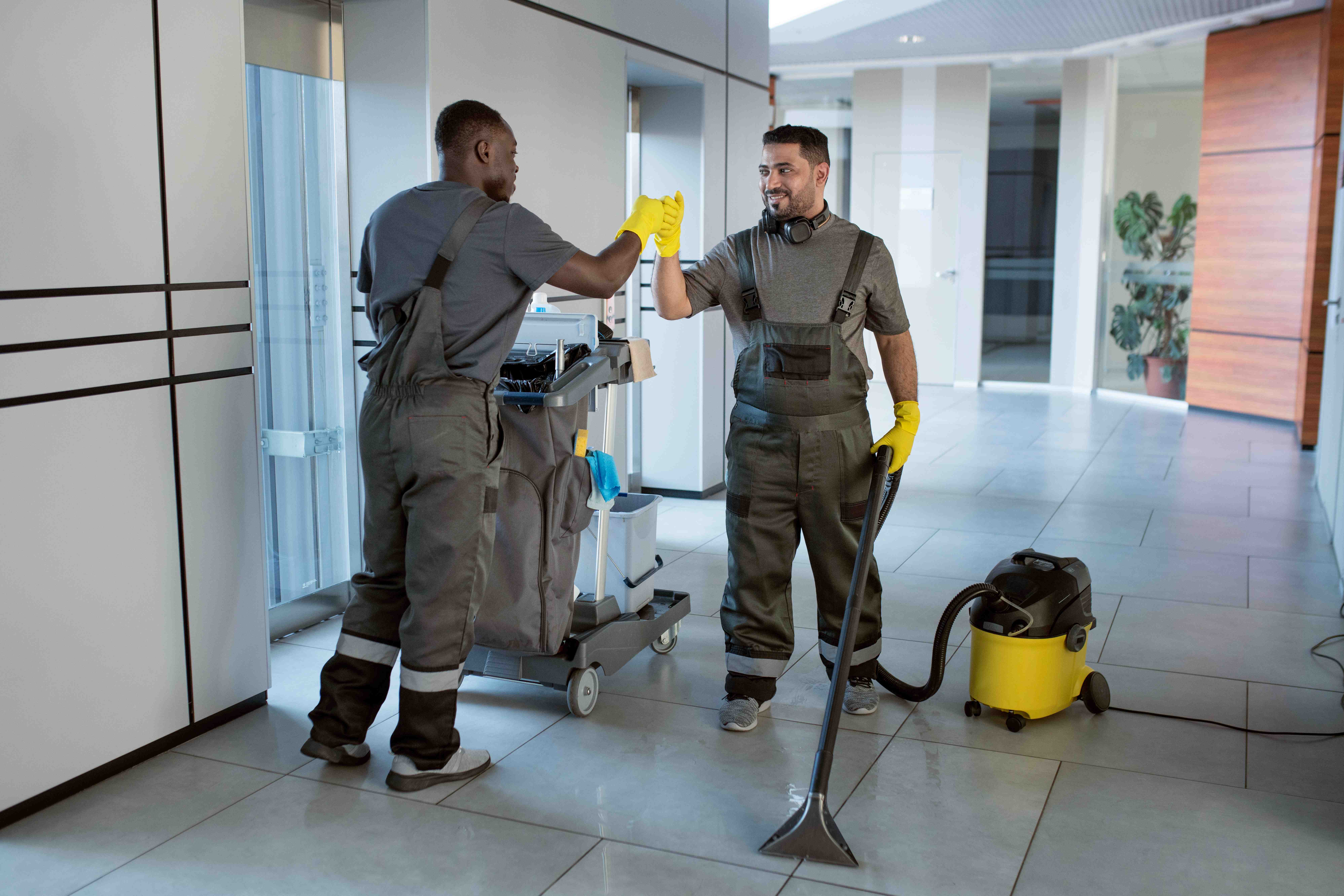 Professional cleaning crew performing final clean after hotel construction
