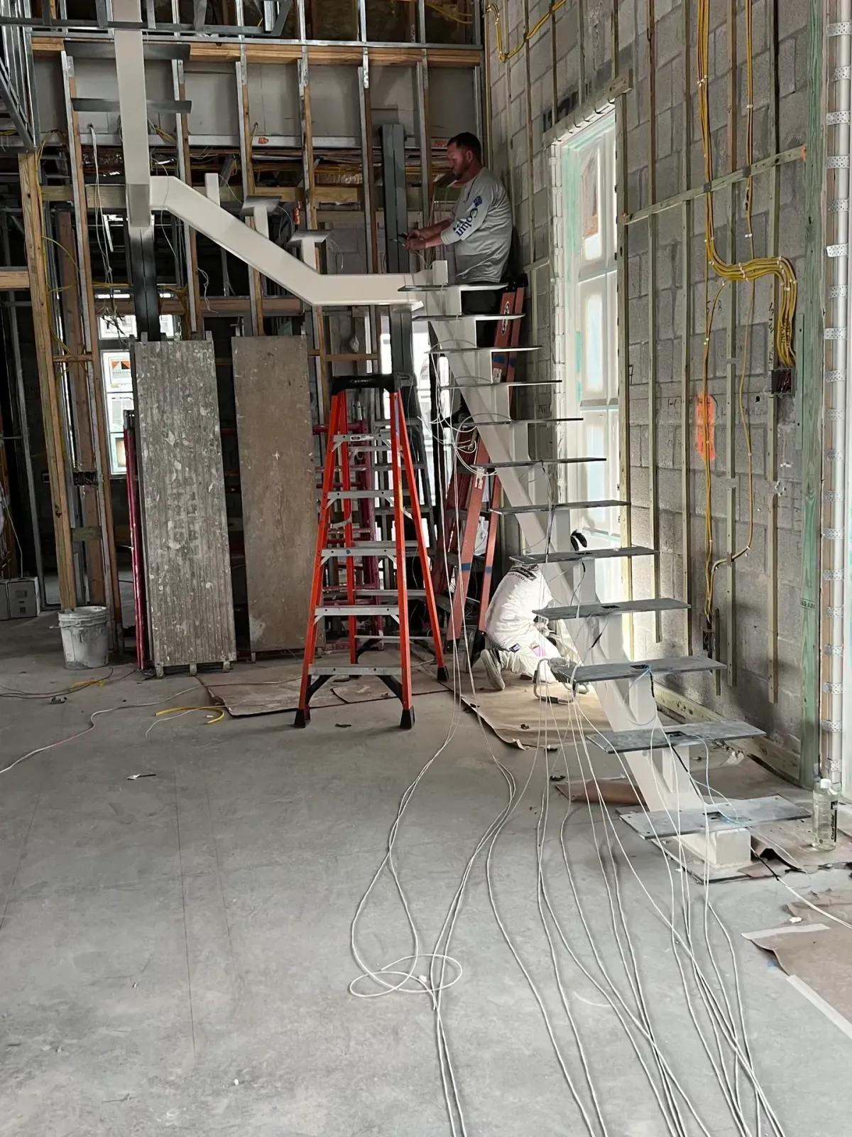 Electrician working on new construction wiring installation – Bee Electrical Contracting, Jupiter and Palm Beach Gardens, FL