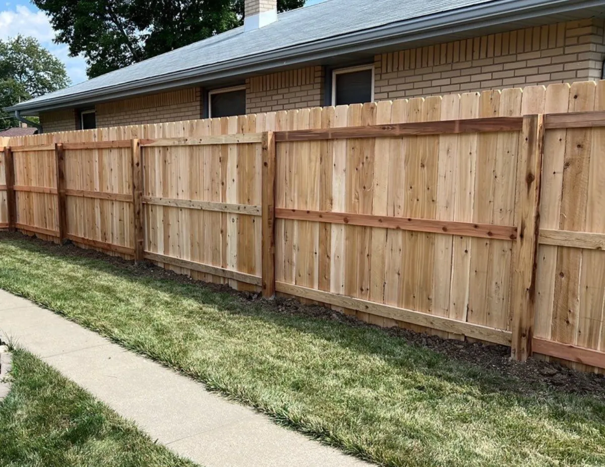 Wood privacy fence installation