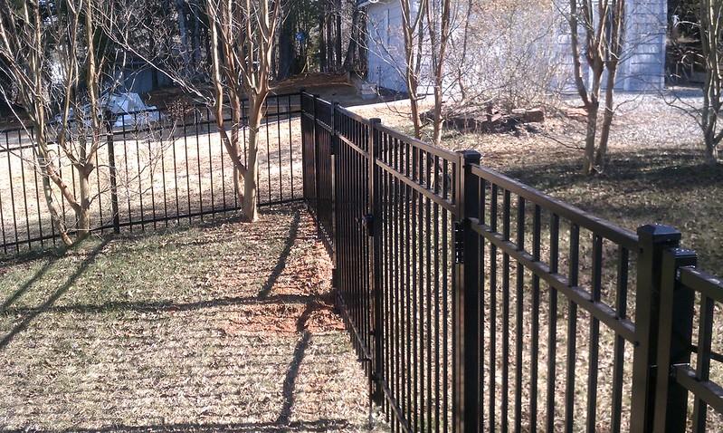 Black aluminum fence on slope