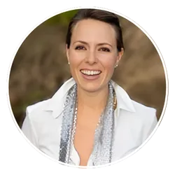 Samantha Ibarguen smiling in white blazer, healing trauma speaker
