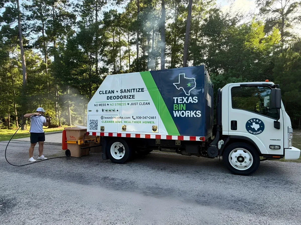 Texas Bin Works truck providing curbside trash can cleaning at a residential property in Texas.