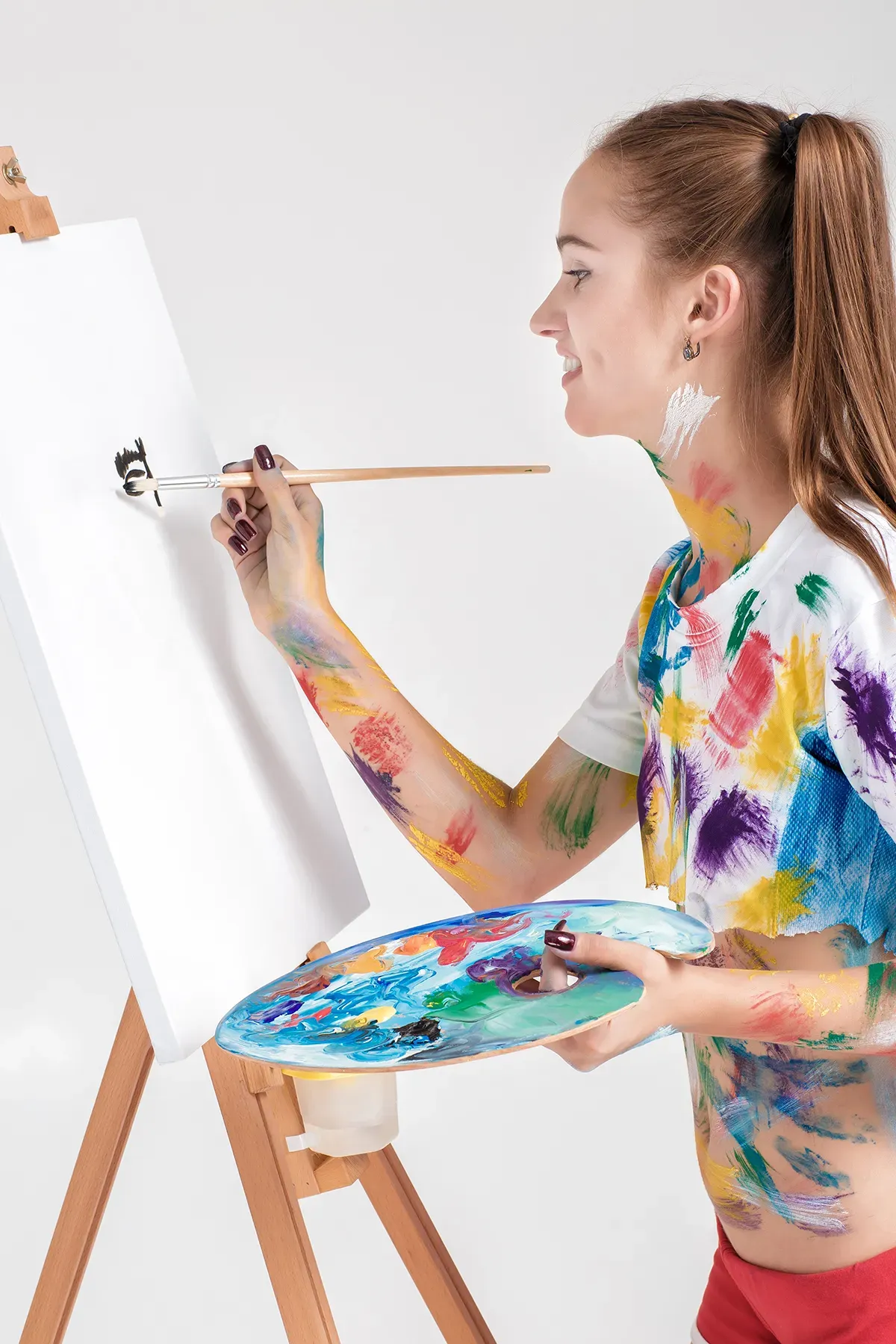 A parent and child enthusiastically working on a creative art project together at home