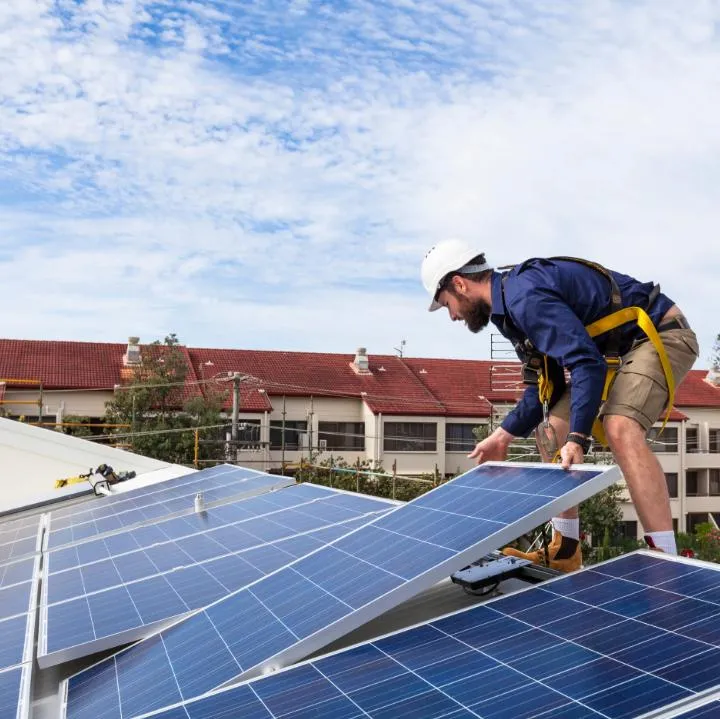 Workers installing panels