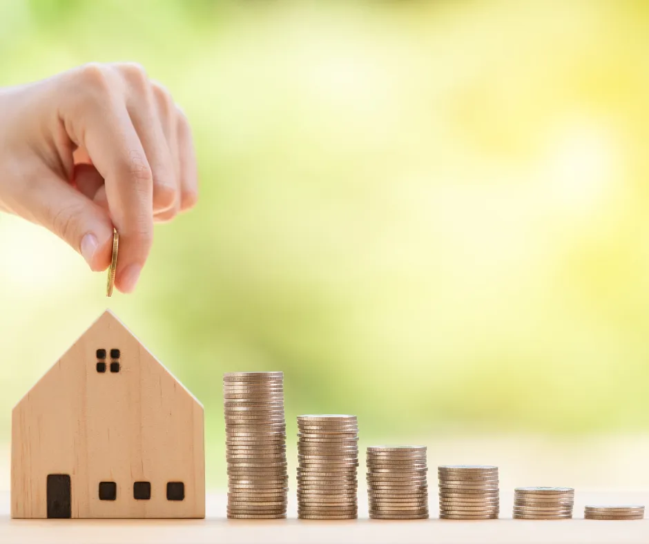 A man walking across a street next to a tall building