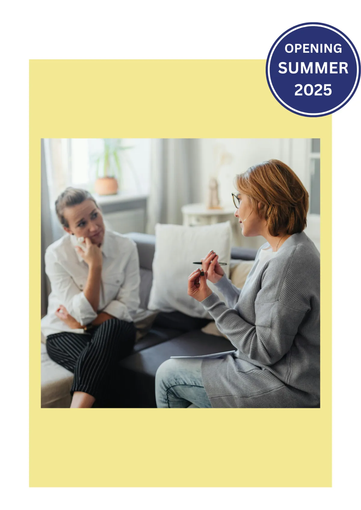 A woman engages in a conversation with a therapist in a supportive and professional setting.