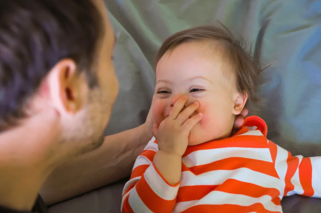 Father with baby with down syndrome; Paths 2 Communication