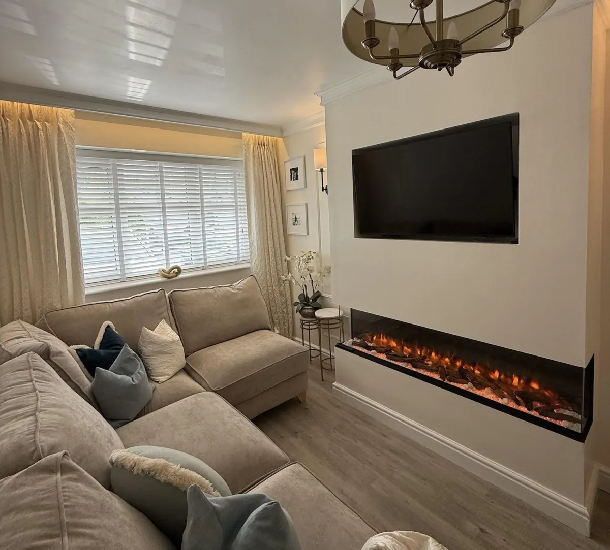 Garage conversion in Rossendale transformed into a stylish living room with bespoke media wall