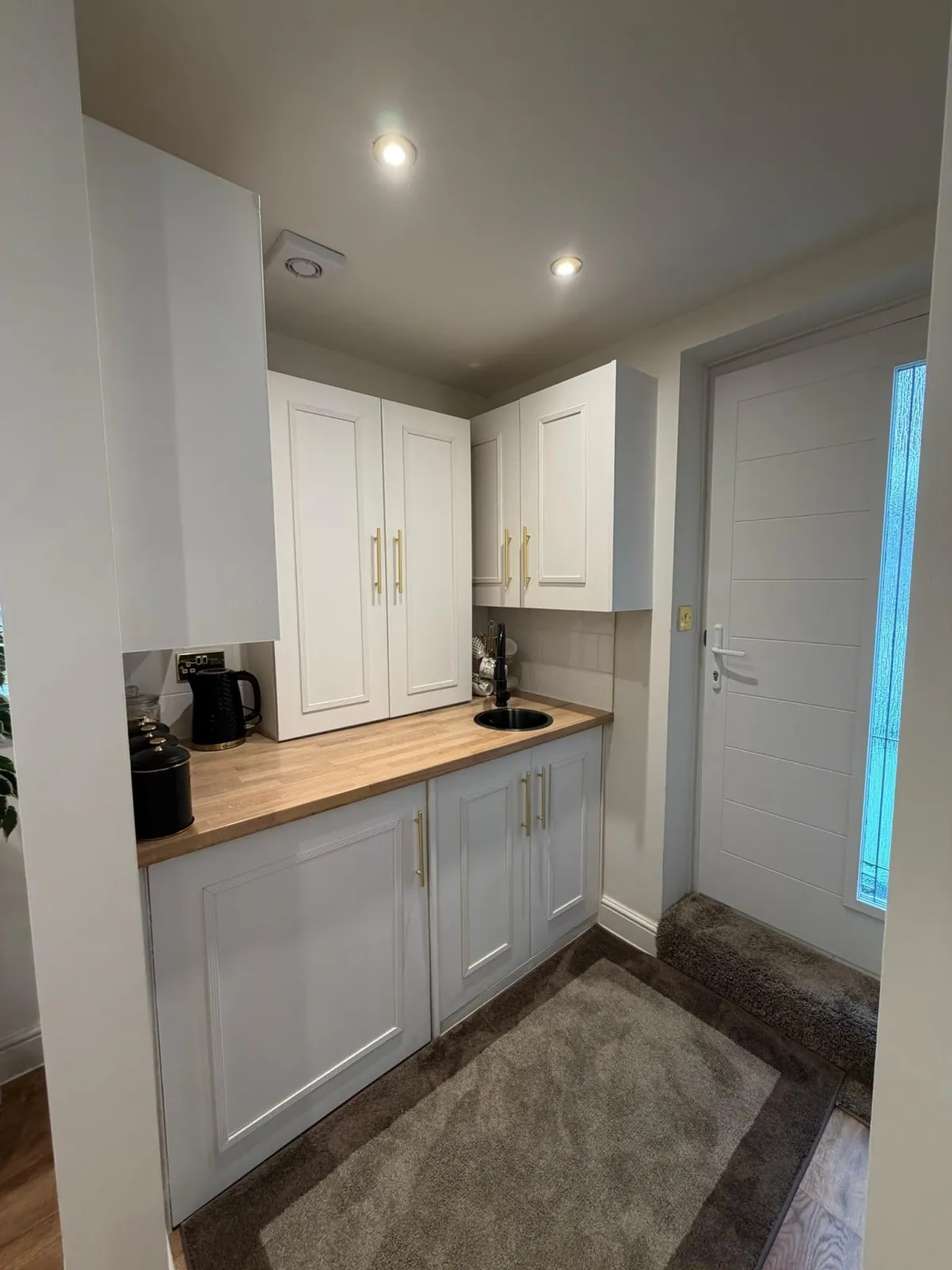 Garage conversion in Rochdale designed as a home office with fitted storage, sink area and annexe ready layout for future self contained living