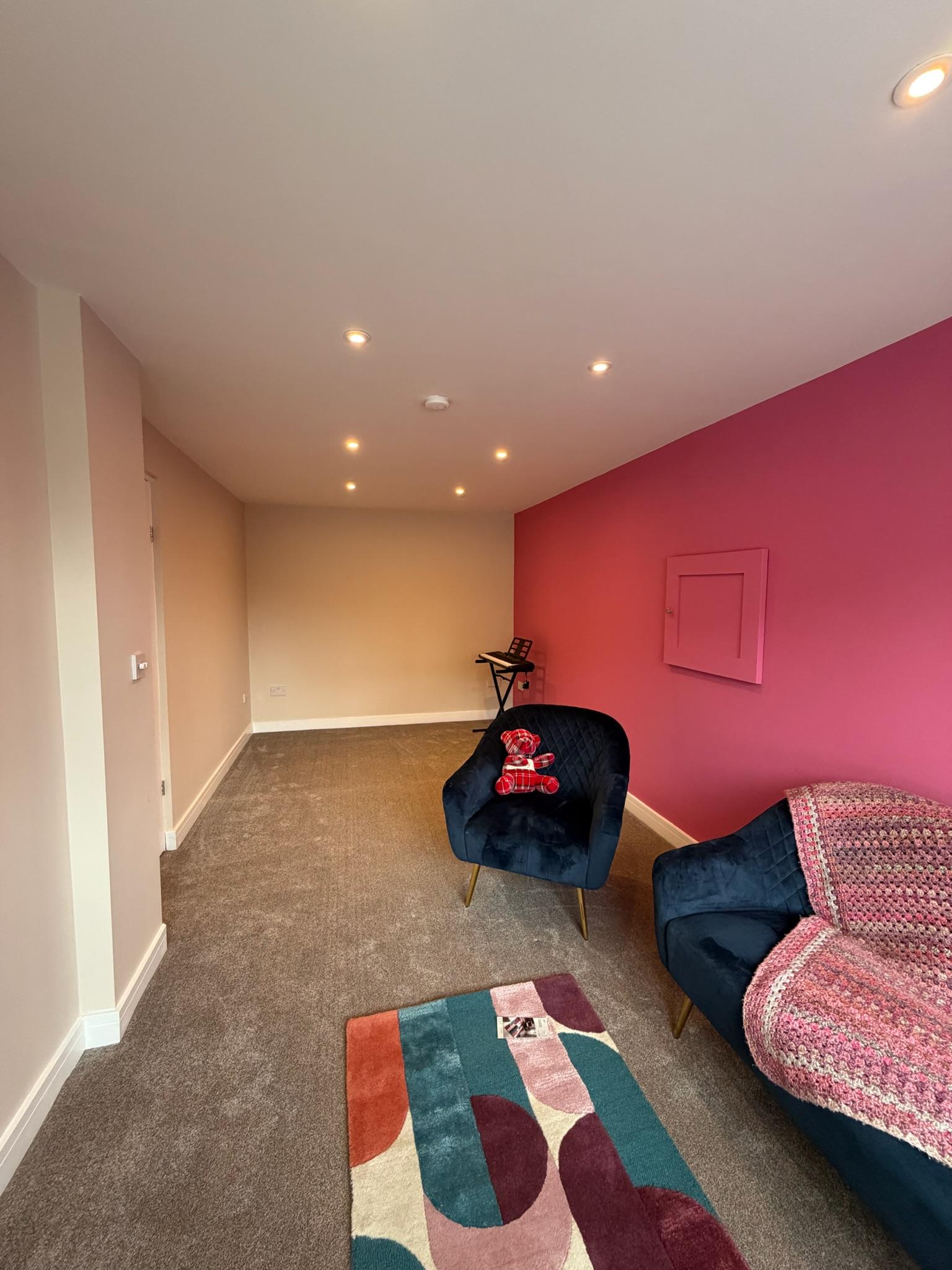 Finished garage conversion in Liverpool transformed into a comfortable living space, showing how an existing garage can become a fully finished room.