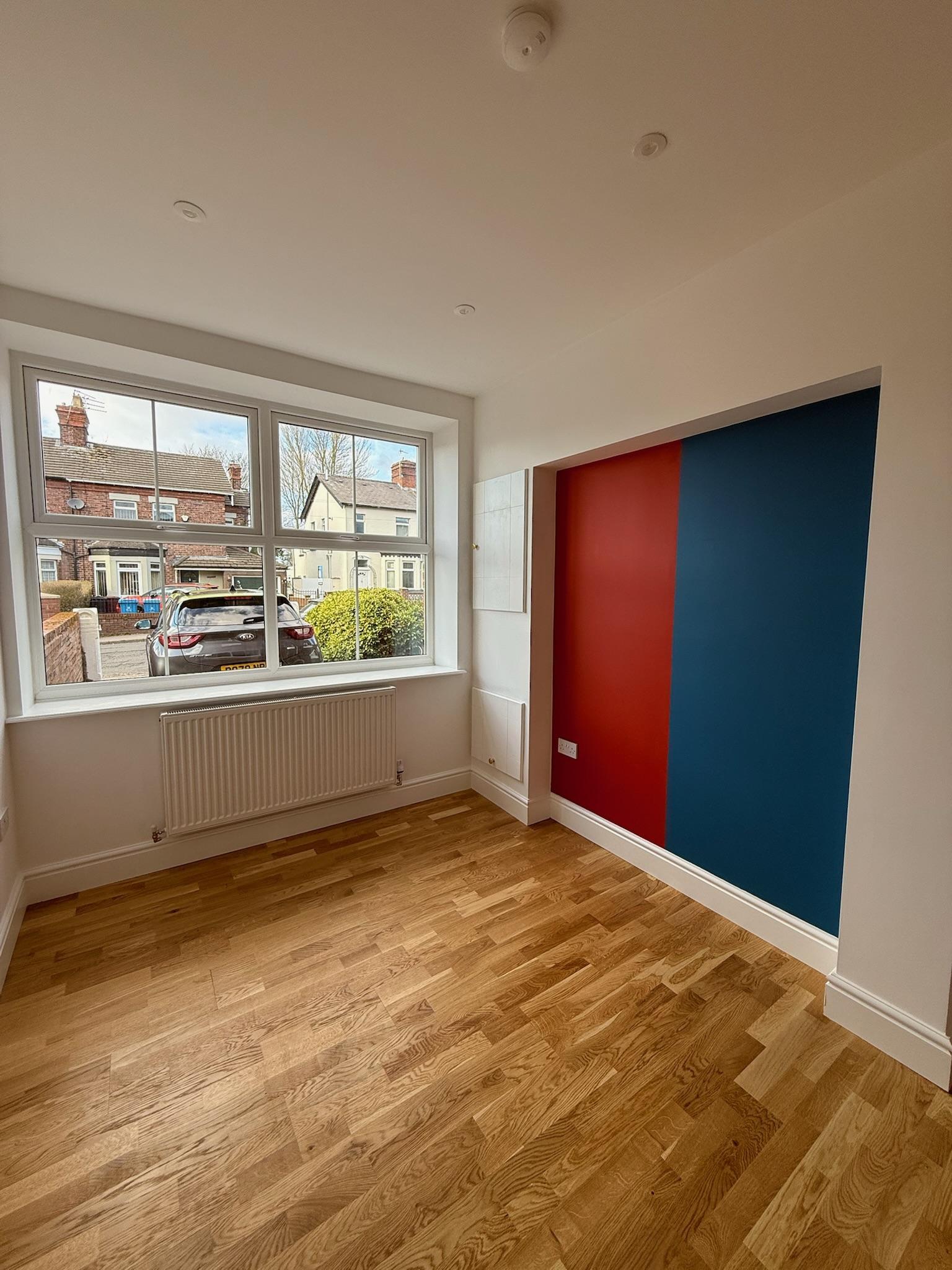 Finished single garage conversion in Liverpool showing how careful planning of ceiling height and headroom can create a comfortable, fully usable living space.