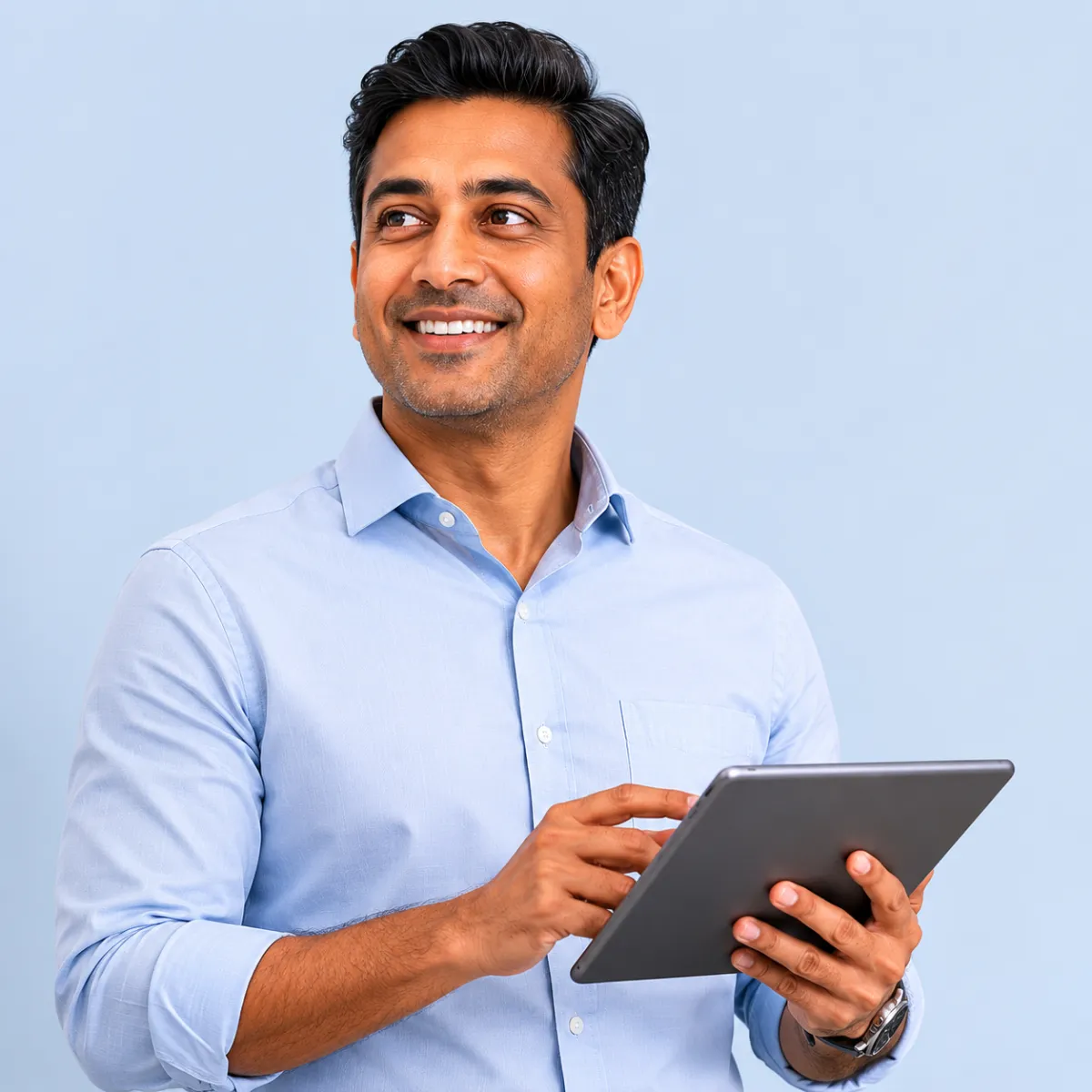 Professional reviewing digital information on a tablet, representing mobile access to healthcare workflows and patient data.