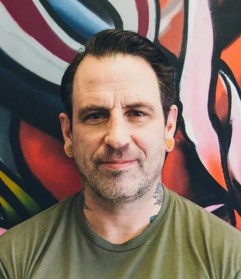 Tim Davis owner and tattoo artist and Awarded-winning tattoo 