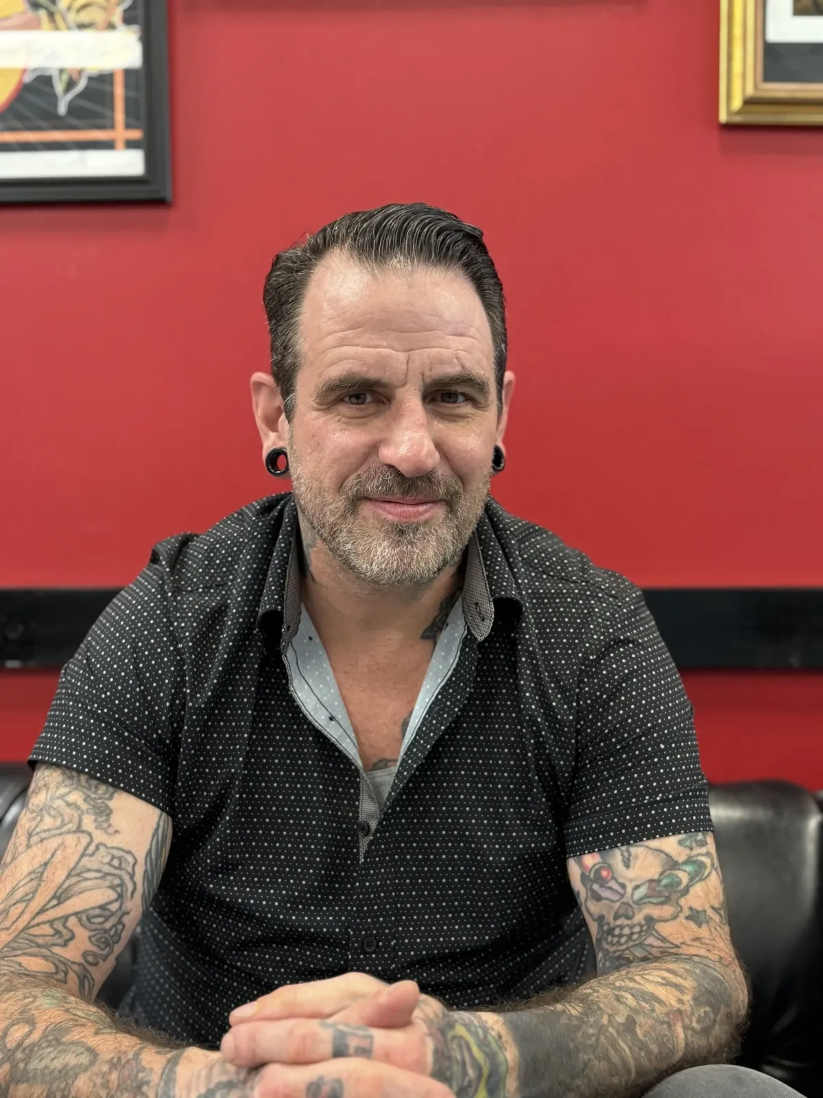 Tim Davis owner and tattoo artist and Awarded-winning tattoo