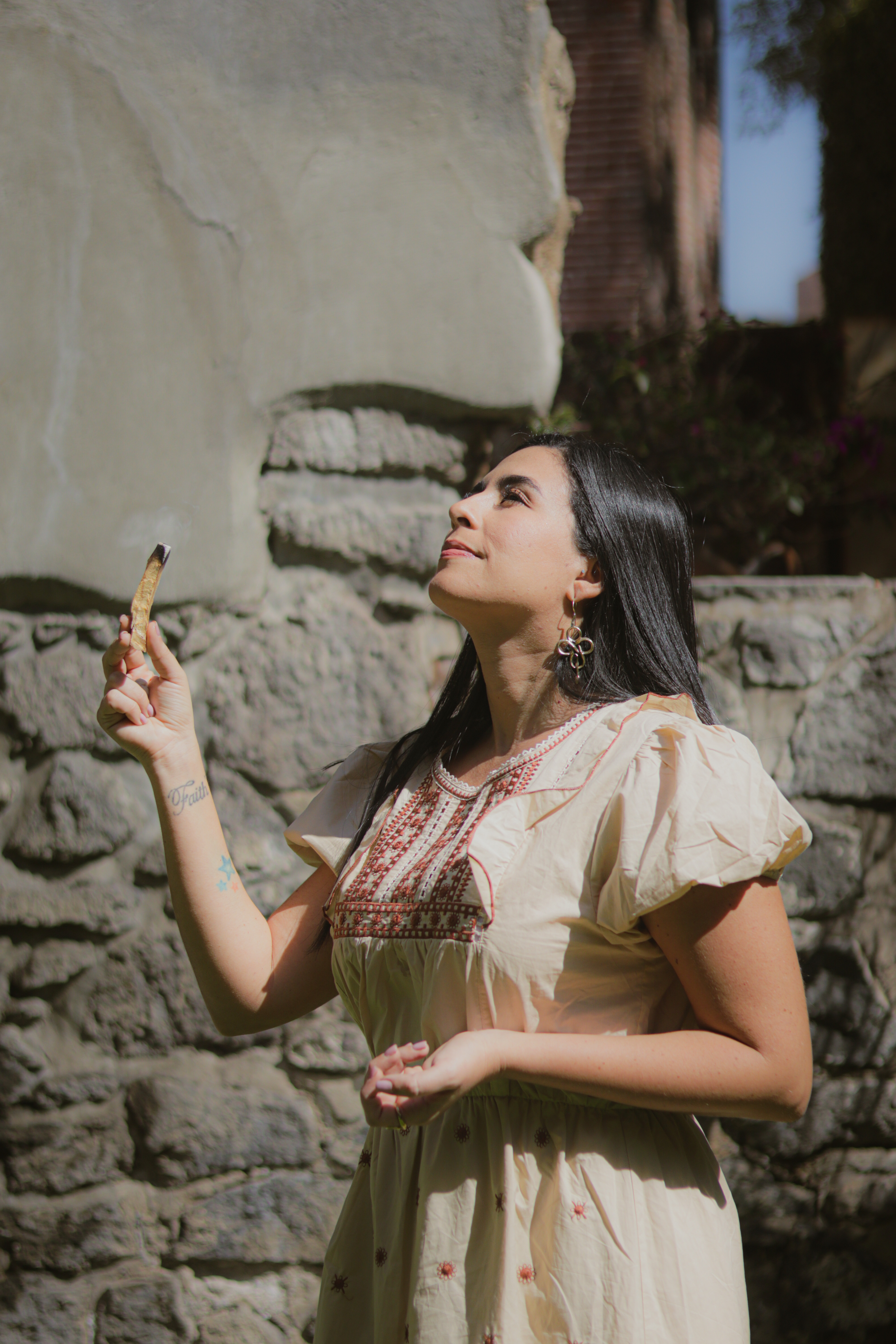 Green leaves and white flowers of a flowering tree.