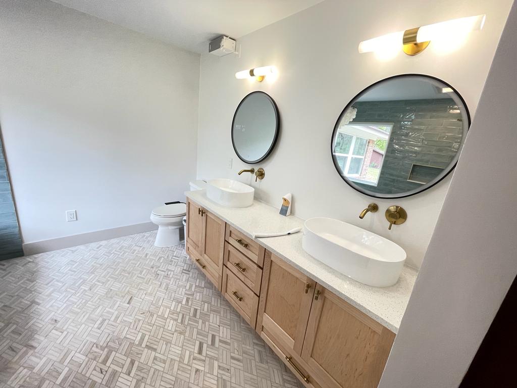 woman holding white mug while standing